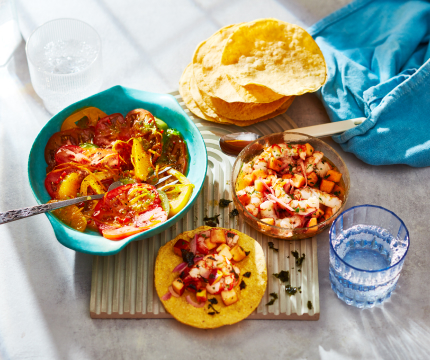 bowl of shrimp ceviche and taco shells, with side bowl of heirloom tomato ceviche